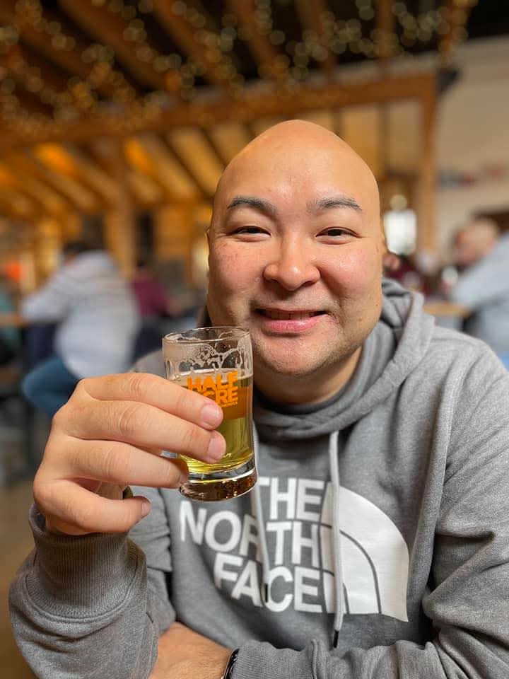 Tony Cu enjoying food and drinks